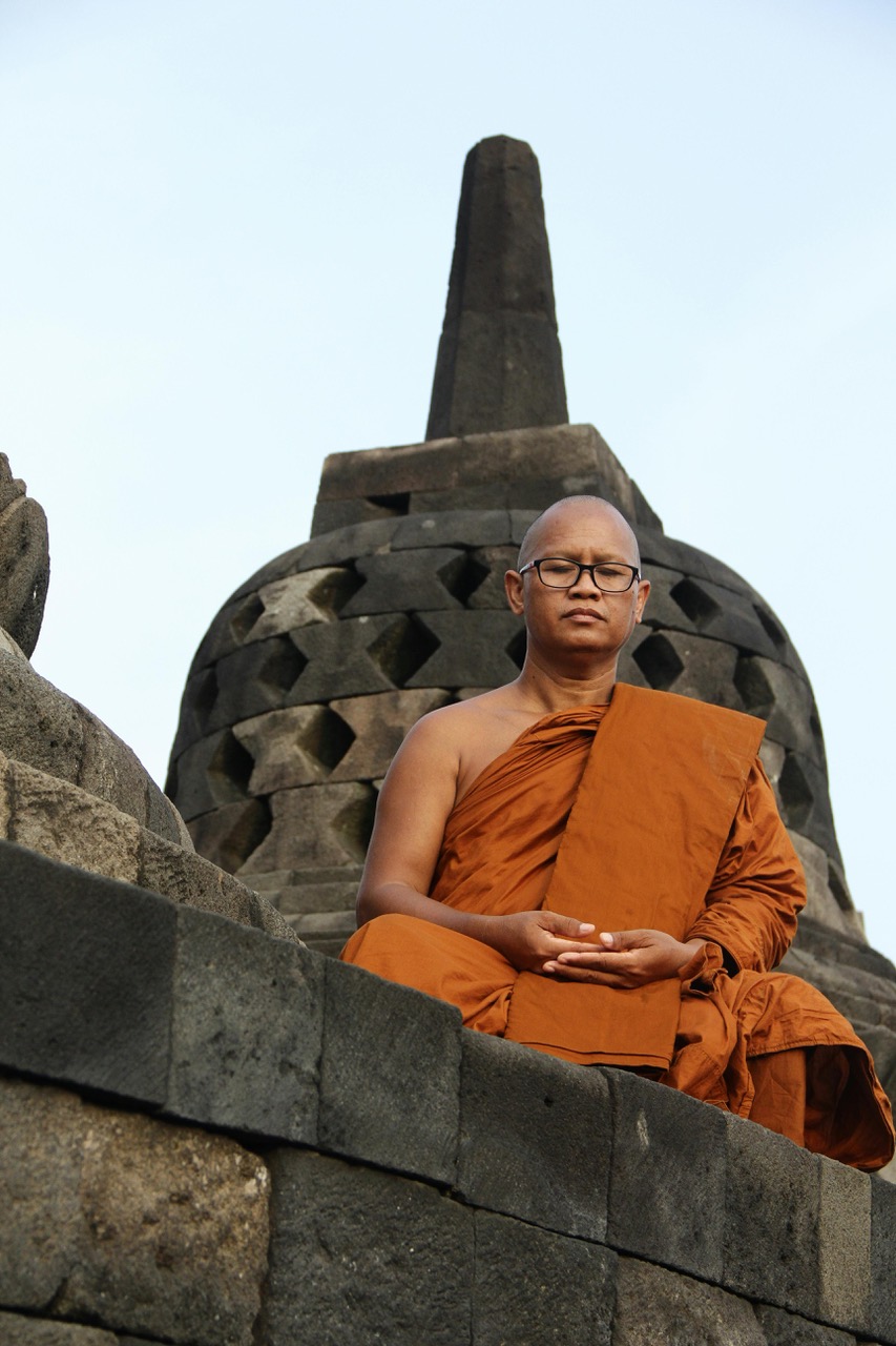 Buddhist monk meditating at Borobudur Temple - Indonesia cultural experience